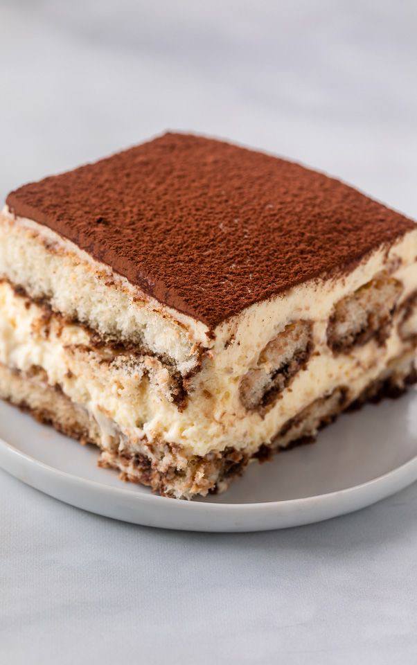 A slice of tiramisu dusted with cocoa